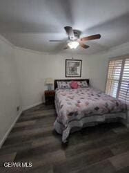 bedroom with dark hardwood / wood-style floors and ceiling fan