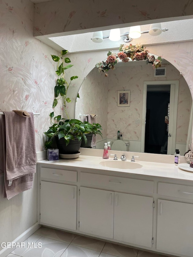 bathroom featuring vanity and tile patterned floors