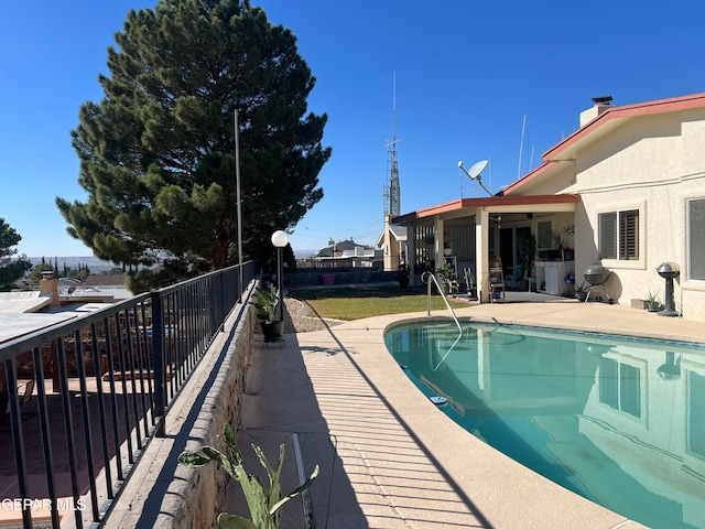 view of swimming pool featuring a patio area