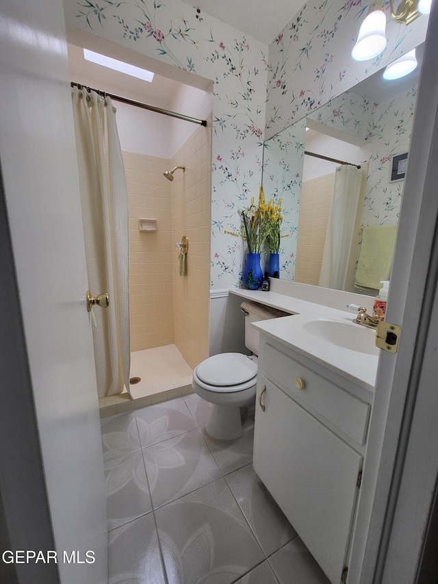 bathroom with walk in shower, tile patterned floors, toilet, and vanity