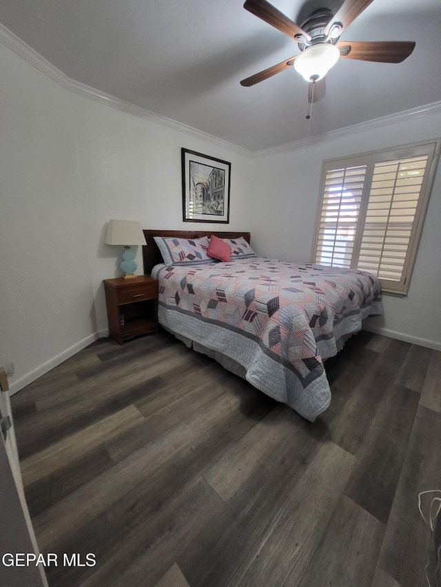 bedroom featuring dark hardwood / wood-style flooring, ornamental molding, and ceiling fan