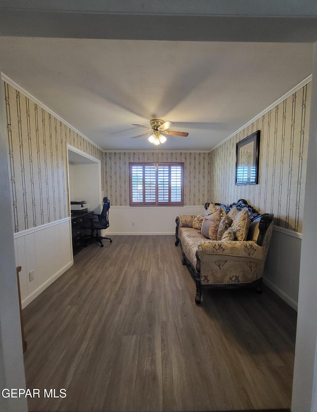 living room with ceiling fan, ornamental molding, and dark hardwood / wood-style flooring