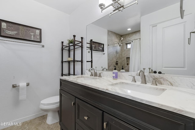 bathroom with walk in shower, vanity, and toilet