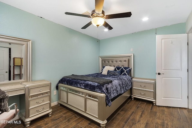 bedroom with ceiling fan and dark wood-type flooring