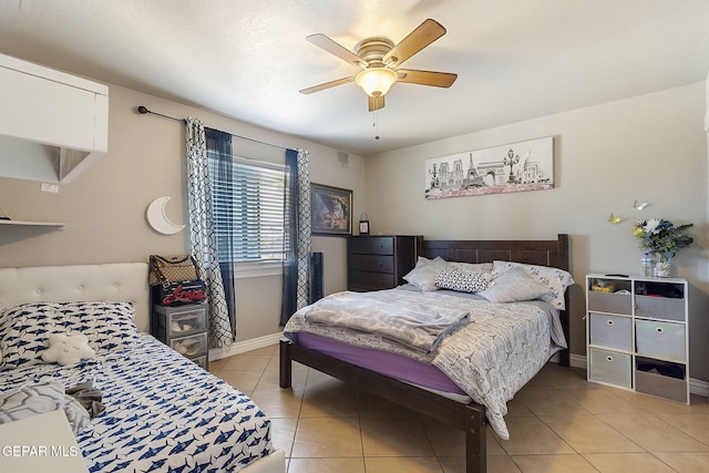 bedroom featuring ceiling fan and light tile patterned flooring