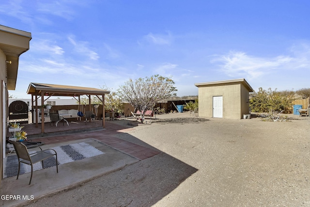 view of patio / terrace with a storage shed