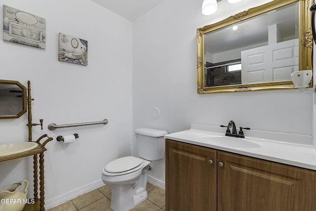 bathroom with walk in shower, tile patterned flooring, vanity, and toilet