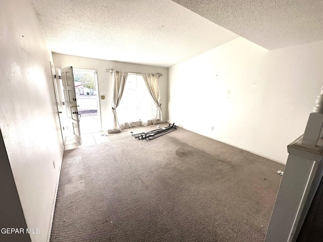 10545 Springwood Dr, El Paso, TX 79925 - spare room featuring carpet flooring and a textured ceiling