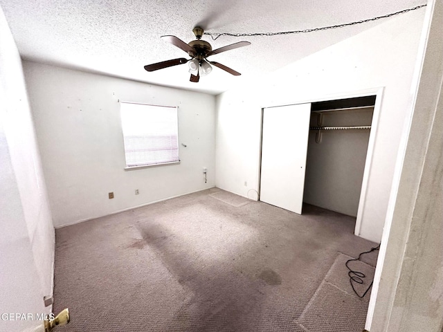 10545 Springwood Dr, El Paso, TX 79925 - unfurnished bedroom with a closet, a textured ceiling, carpet flooring, and a ceiling fan