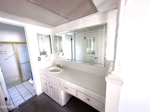 10545 Springwood Dr, El Paso, TX 79925 - bathroom with toilet, vanity, a shower with door, and tile patterned flooring