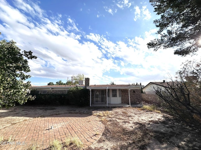 10545 Springwood Dr, El Paso, TX 79925 - back of house featuring a patio area