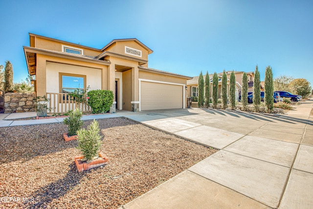 view of front of house featuring a porch and a garage