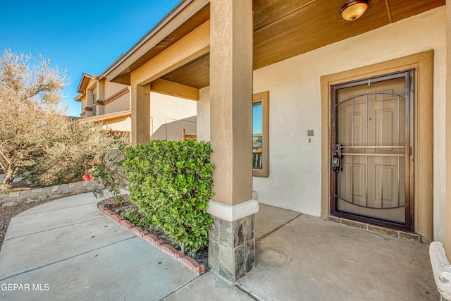 doorway to property featuring a porch