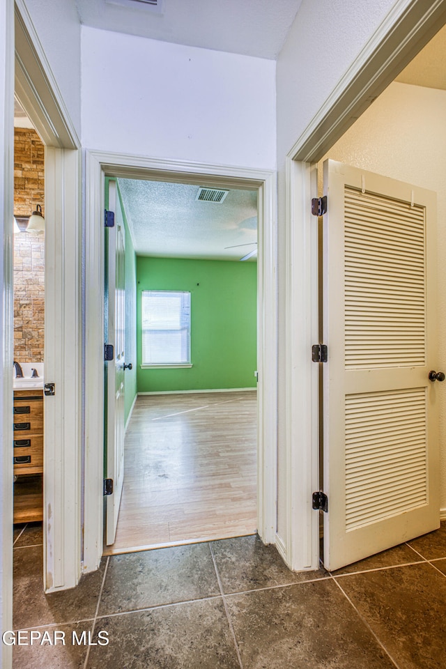 hallway with dark wood-type flooring