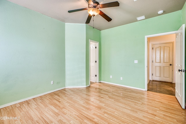 unfurnished bedroom with light hardwood / wood-style flooring and ceiling fan