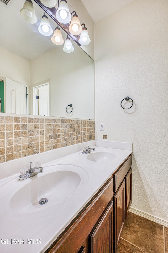 bathroom featuring tile patterned flooring and vanity