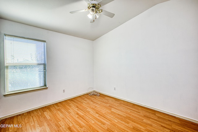 unfurnished room featuring hardwood / wood-style flooring, ceiling fan, and lofted ceiling