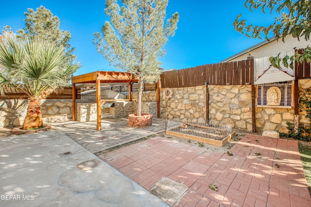 view of patio / terrace featuring exterior kitchen