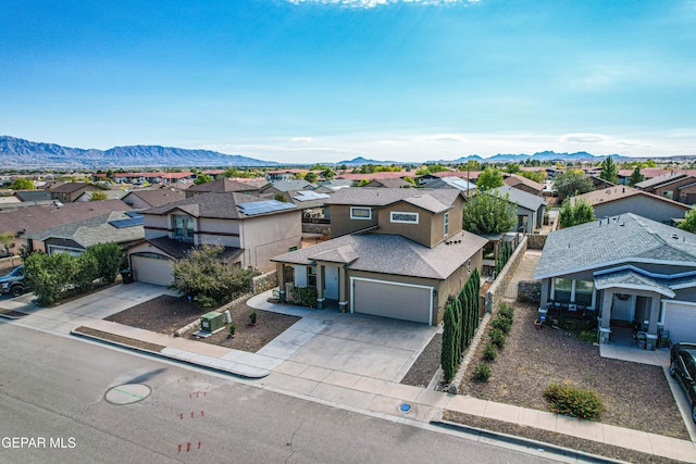 birds eye view of property featuring a mountain view