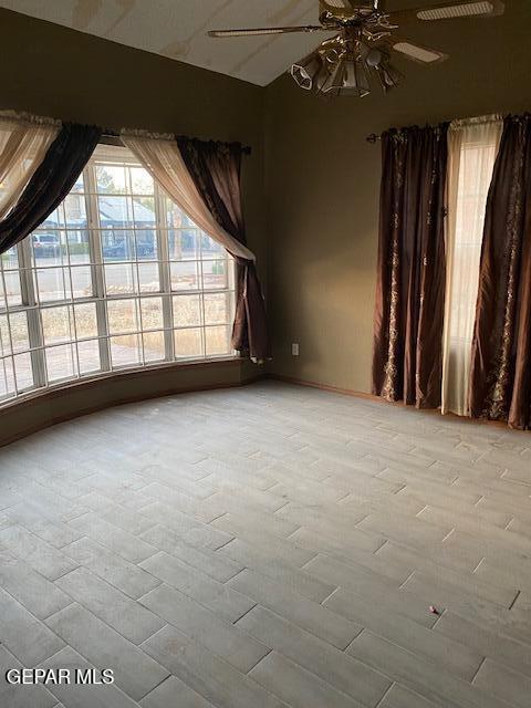 unfurnished room featuring ceiling fan