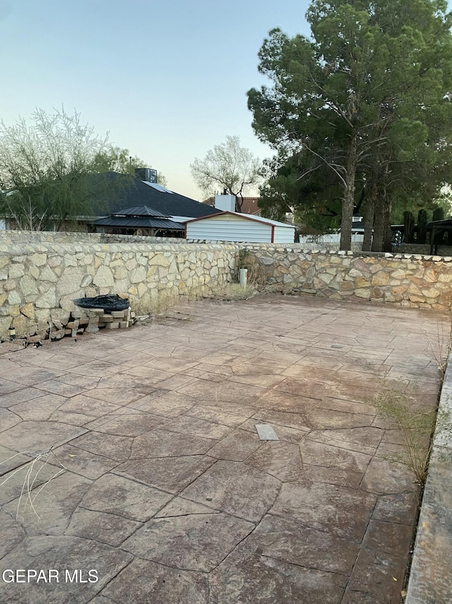 view of patio / terrace with a fire pit