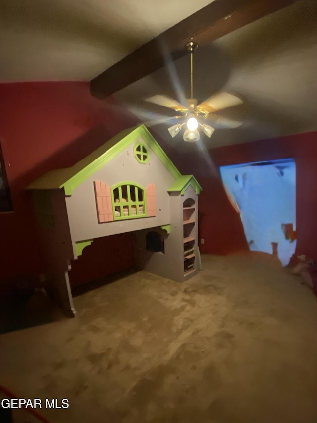 additional living space featuring lofted ceiling with beams, carpet floors, and ceiling fan