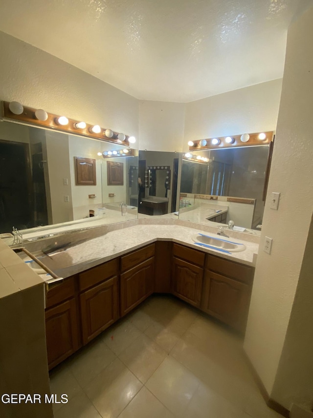 bathroom with vanity and tile patterned floors