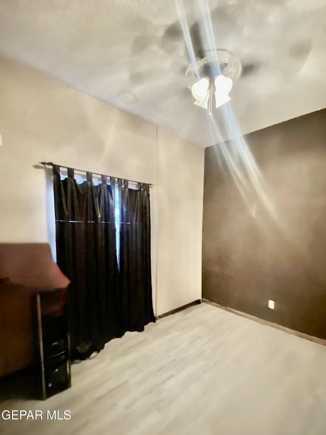 bonus room with light wood-type flooring