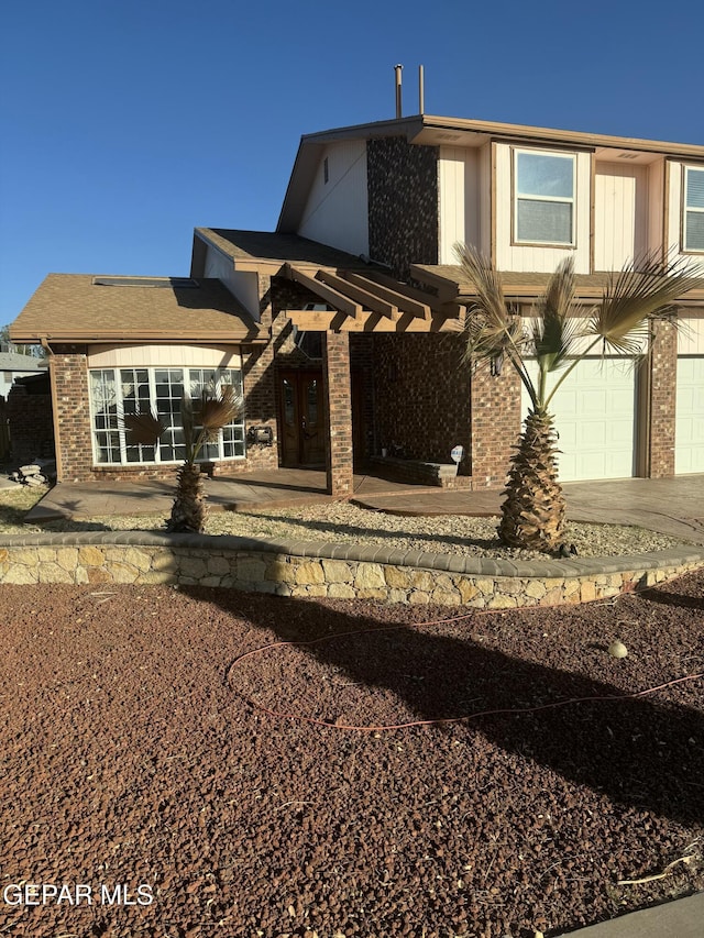 view of front of home with a garage