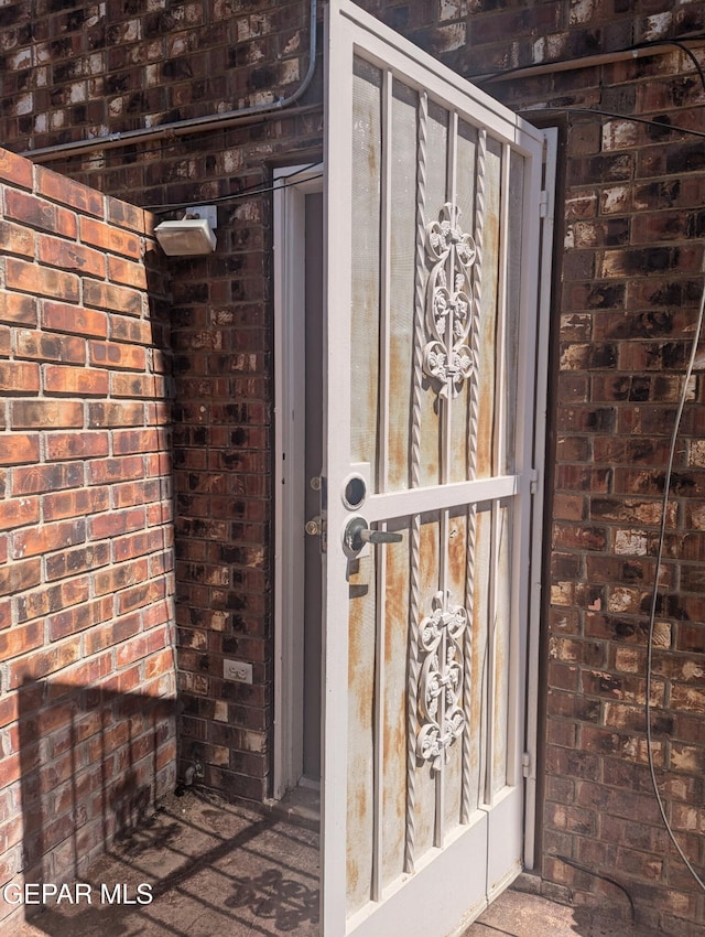 2078 Gus Moran St, El Paso, TX 79936 - view of exterior entry featuring brick siding
