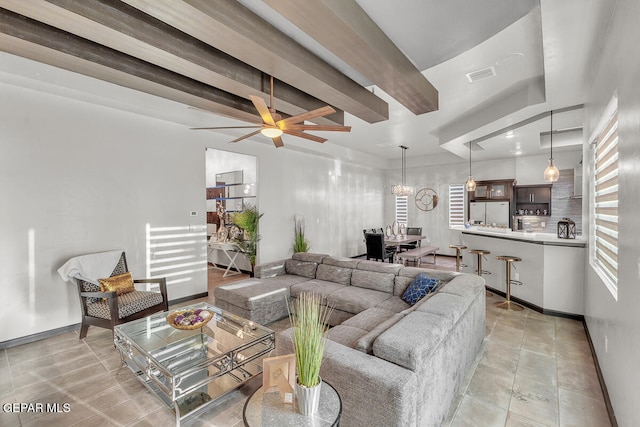 living room with beamed ceiling, ceiling fan, and light tile patterned flooring