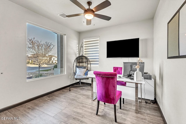 office space with ceiling fan and light wood-type flooring