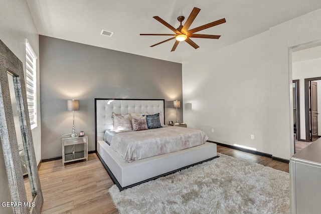 bedroom with ceiling fan and hardwood / wood-style floors