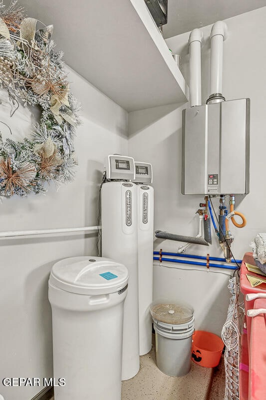 utility room featuring water heater