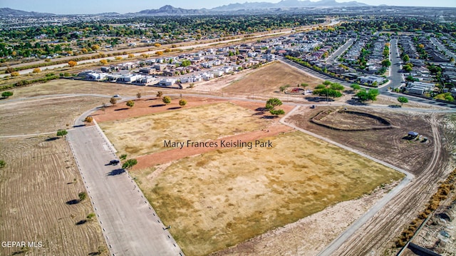 birds eye view of property with a mountain view