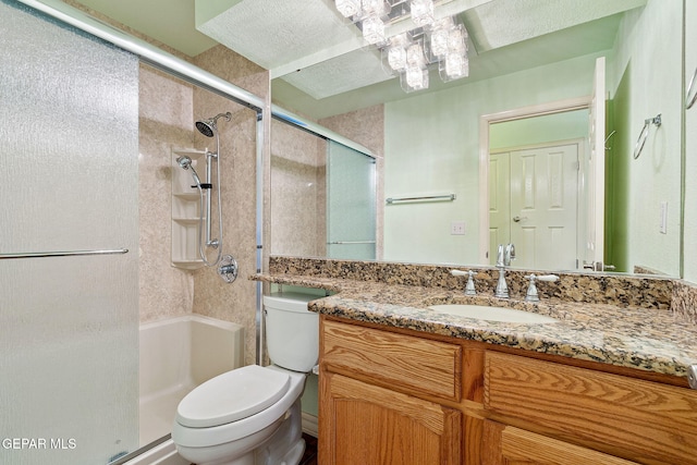 bathroom featuring walk in shower, vanity, and toilet