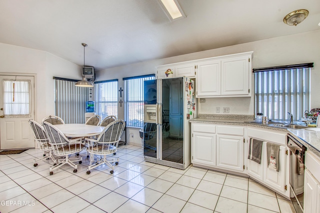 kitchen featuring white cabinets, vaulted ceiling, black appliances, and hanging light fixtures