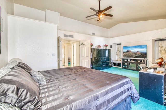 bedroom featuring ceiling fan, vaulted ceiling, and carpet