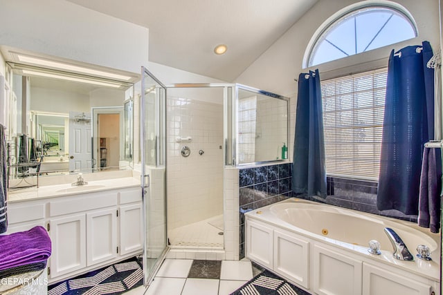 bathroom with separate shower and tub, tile patterned flooring, lofted ceiling, and vanity