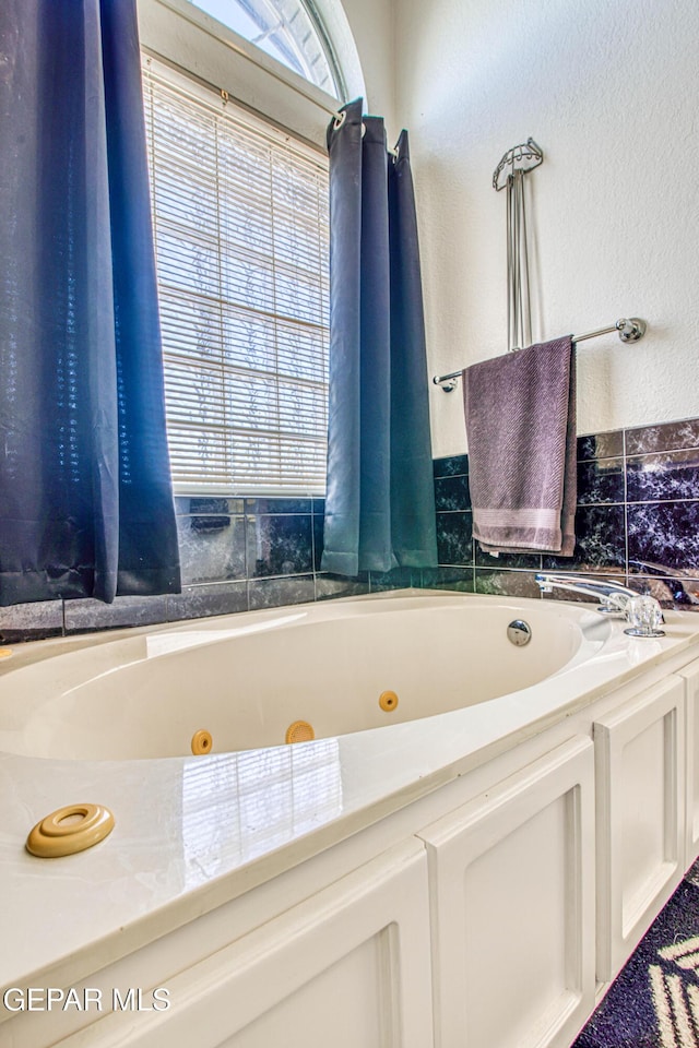 bathroom featuring a tub