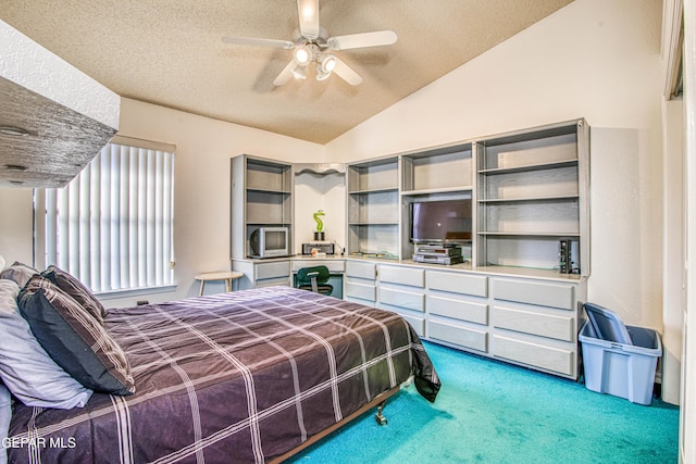 carpeted bedroom featuring ceiling fan, vaulted ceiling, and a textured ceiling