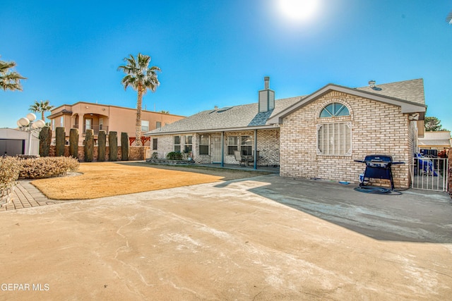 back of property with a patio