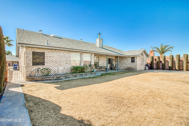 rear view of property featuring a patio