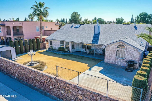 rear view of property featuring a patio area