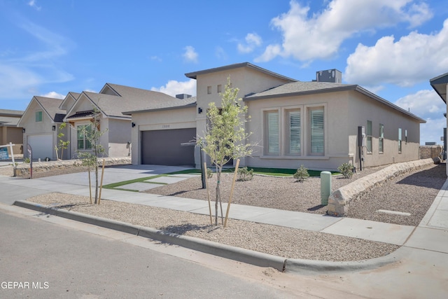 1800 Dana Gray St, El Paso, TX 79928 - view of front facade with driveway, stucco siding, and an attached garage