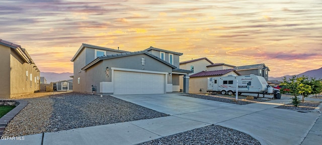 view of front of property with a garage