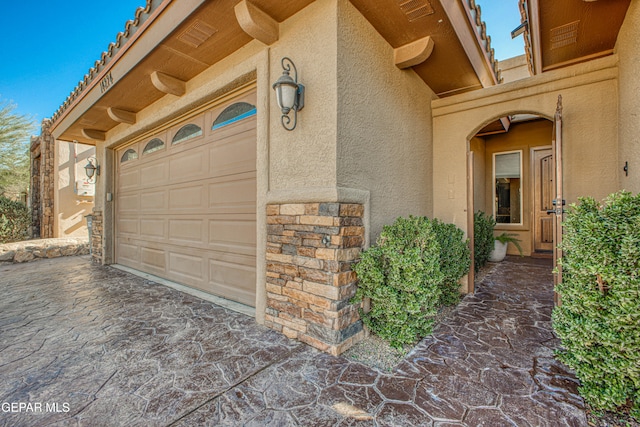 property entrance featuring a garage