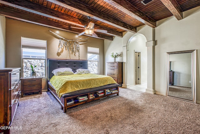 bedroom featuring multiple windows, ceiling fan, carpet, and wood ceiling