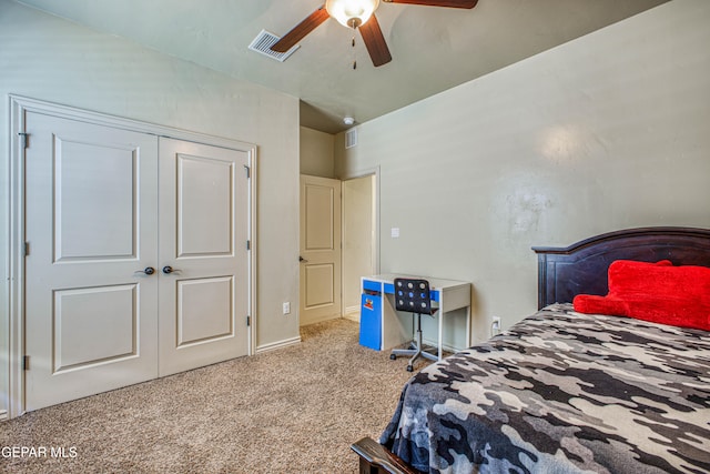 bedroom with ceiling fan, a closet, and light colored carpet