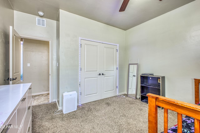 bedroom featuring ceiling fan and carpet floors